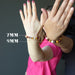 two women with hands out wearing multi colored mookaite jasper round beaded stretch bracelets in 7mm and 9mm