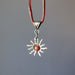 back of red jasper sun necklace