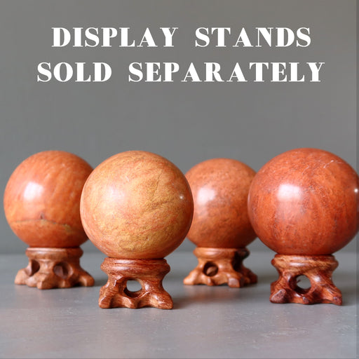 4 red jasper spheres on fancy wood display stands, which are sold separately