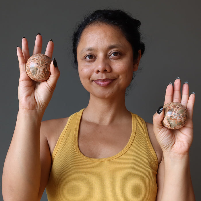 sheila of satin crystals holding two safari jasper spheres