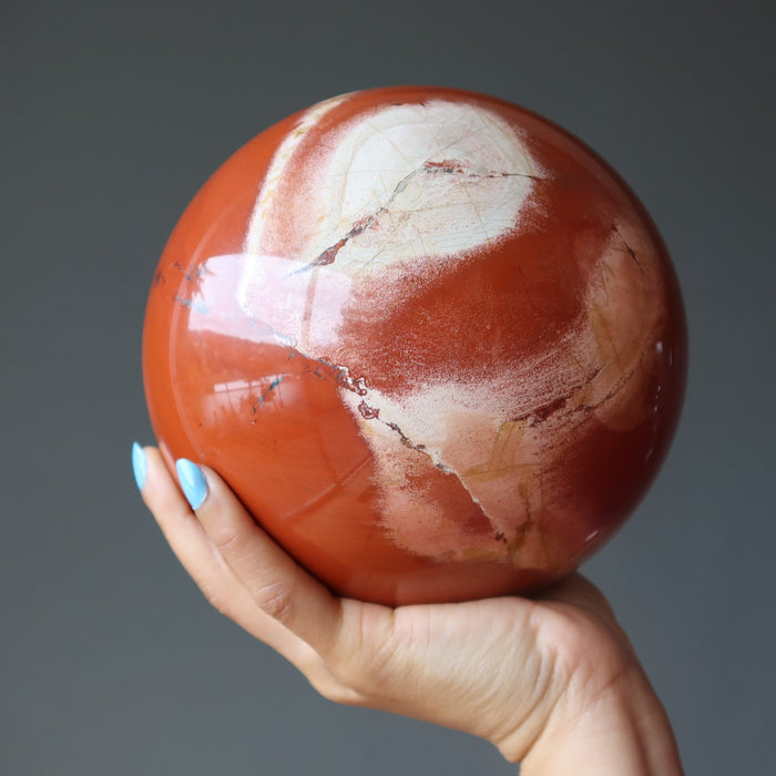 red jasper ball in hand