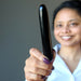 sheila of satin crystals holding a jet stone massage wand