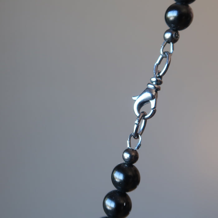showing the gunmetal lobster claw clasp of the black jet stone beaded necklace