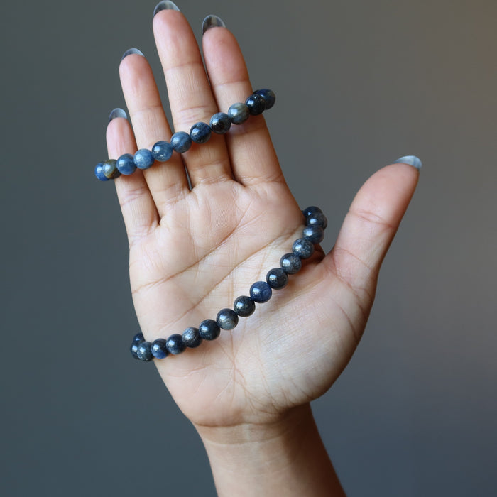 female hand modeling blue kyanite beaded stretch bracelet