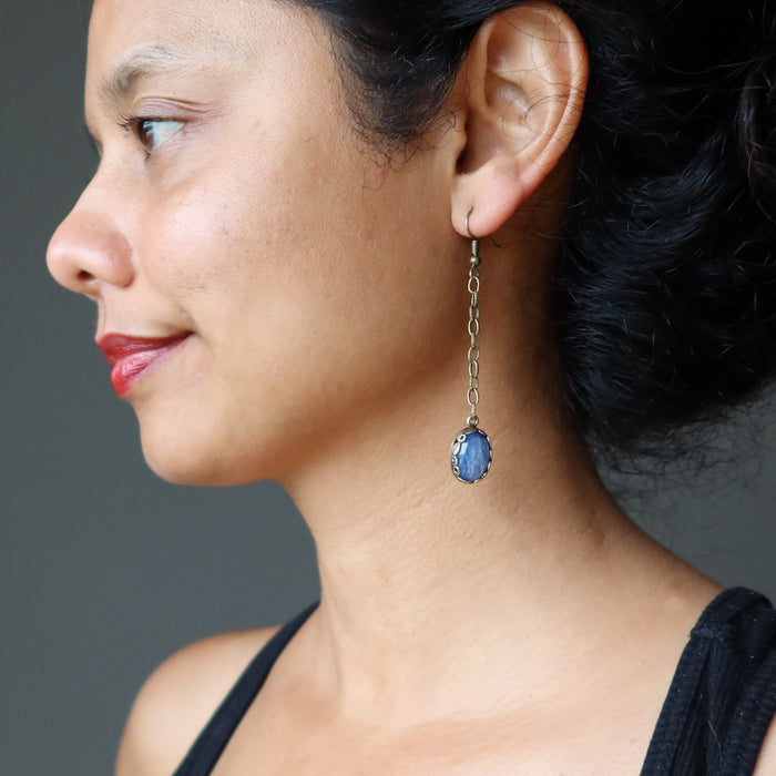 blue kyanite dangle earring on woman