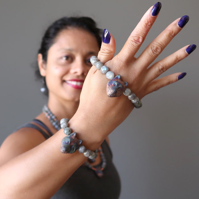 sheila of satin crystals wearing two faceted labradorite and wolf head beaded stretch bracelets