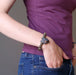 woman with hand in jeans pocket wearing wolf head and labradorite beaded bracelet