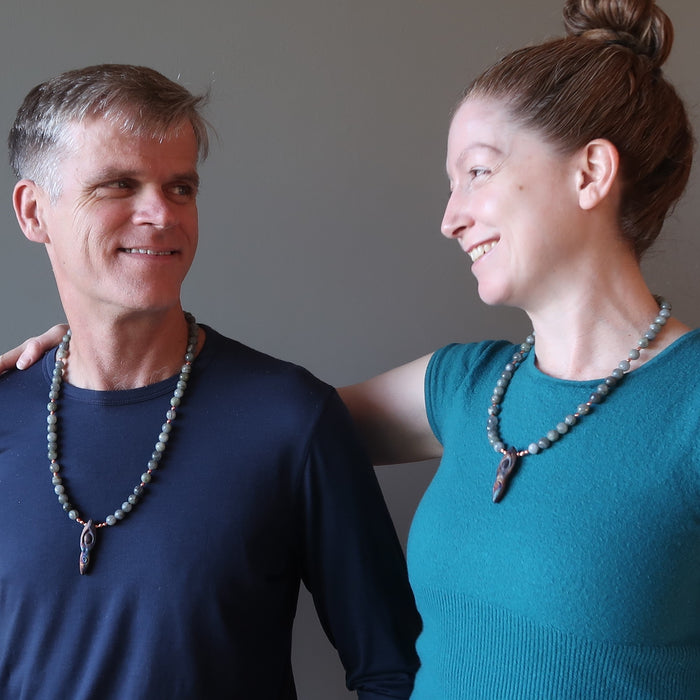 male and female models wearing labradorite goddess necklaces