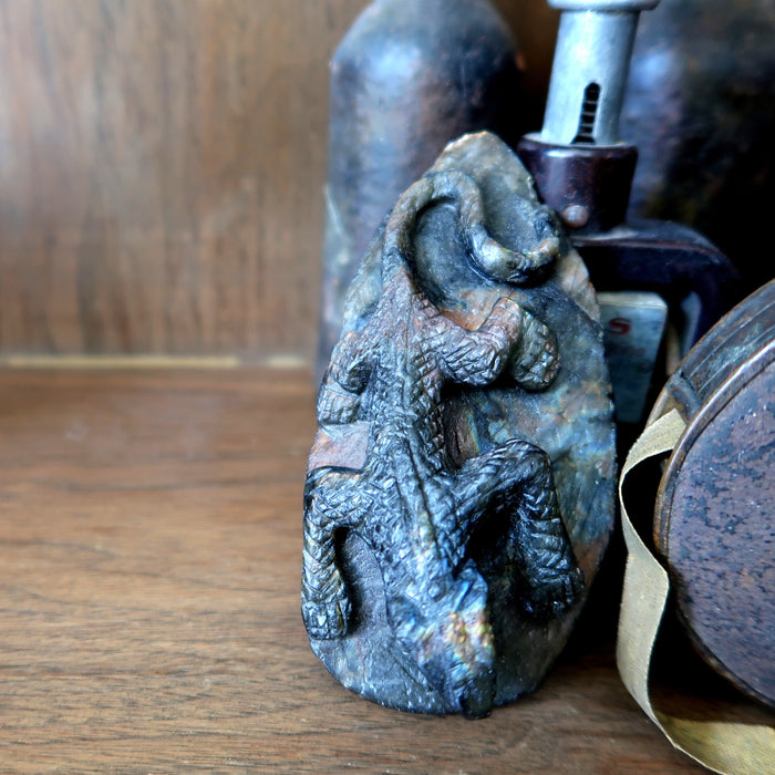 labradorite lizard carving among antiques