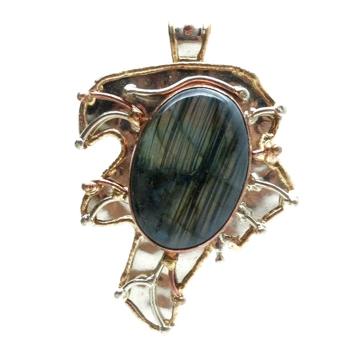 rainbow labradorite oval set in a metal leaf designed pendant