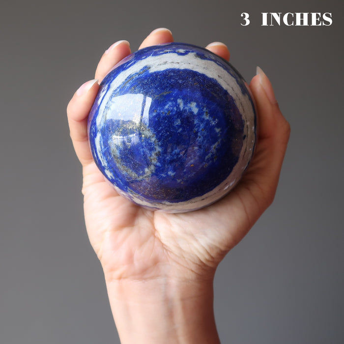 hand holding 3 inch lapis lazuli sphere