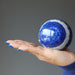 hand holding 3 inch lapis lazuli sphere