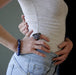 woman with hand on hips wearing lapis lazuli stretch bracelet and large dendritic agate ring