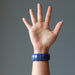 back of hand wearing a chunky lapis lazuli stretch cuff bracelet