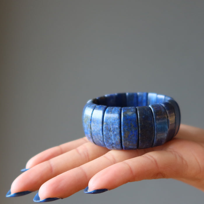 palm holding a chunky lapis lazuli stretch cuff bracelet