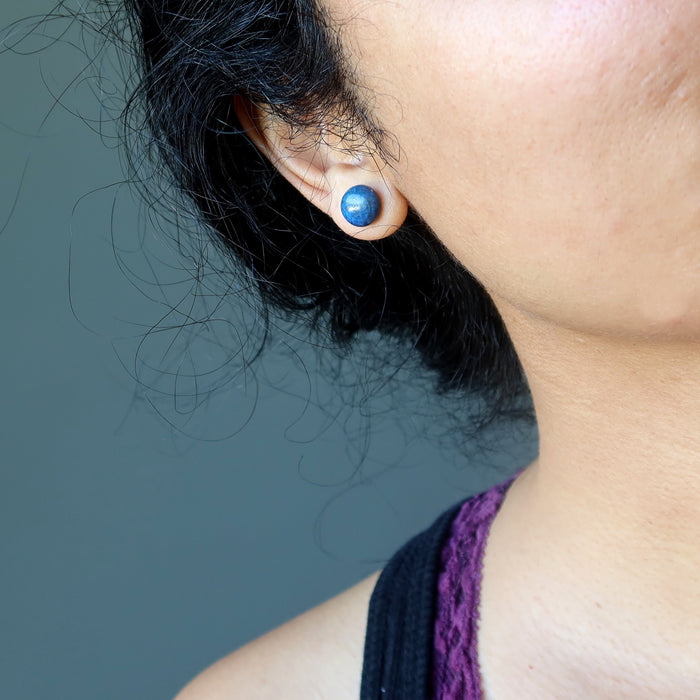 woman wearing lapis stud earring