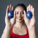 sheila of satin crystals holding two lapis lazuli eggs in her palms