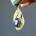 side view of lapis brass hammered pendant