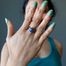 lapis antique brass ring on hand