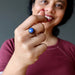 woman wearing lapis round antique copper ring