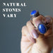 hand holding two lapis rings to show natural stones vary