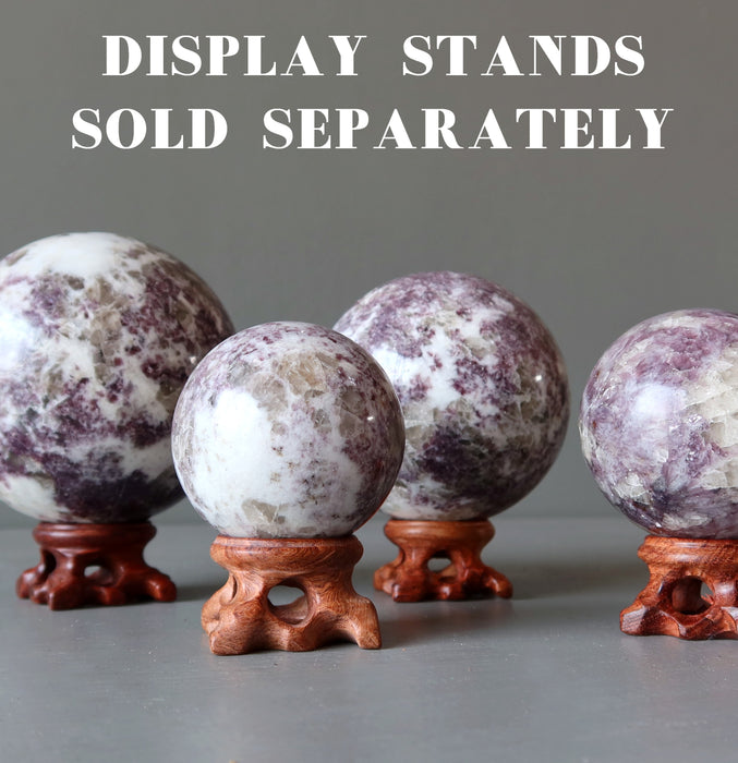 lepidolite balls on wood stands which are sold separately