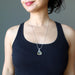 raw yellow libyan desert glass tektite on sterling silver adjustable necklace on female model