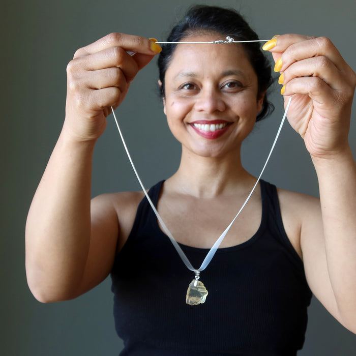 sheila of satin crystals holding raw yellow libyan desert glass tektite on sterling silver adjustable necklace