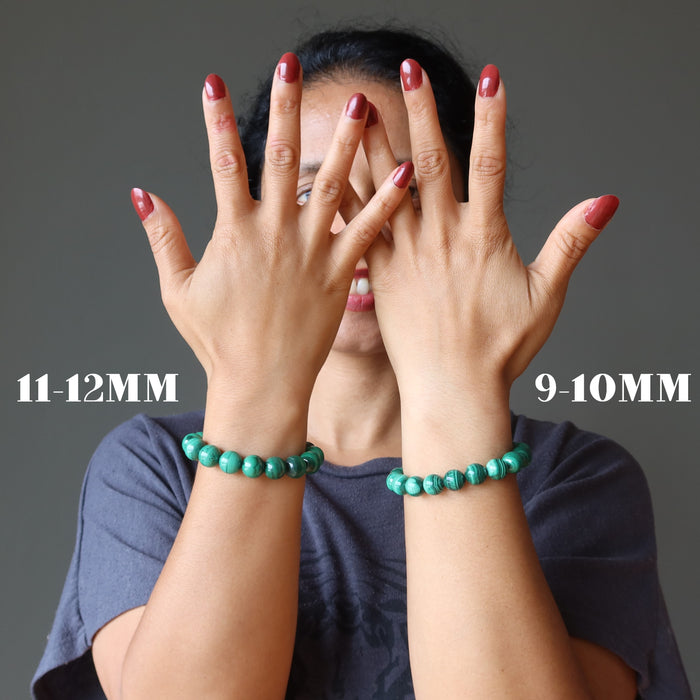 woman wearing two malachite bracelets