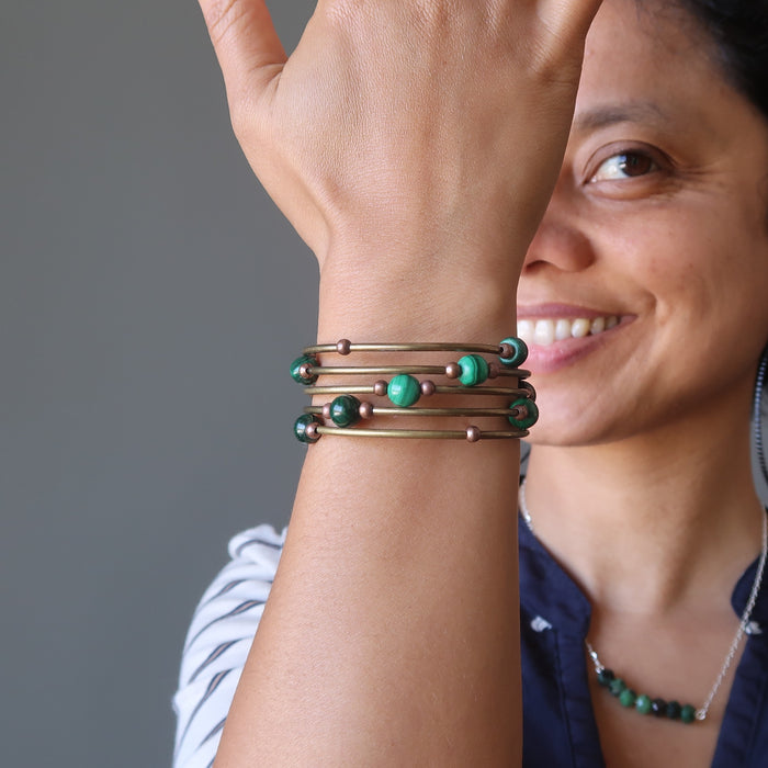 Sheila of Satin Crystals wears her designer Malachite Accordion of Love Bracelet while smiling