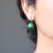 sheila of satin crystals wearing malachite bronze leverback earrings 