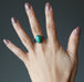hand wearing malachite ring 