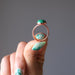 hand holding malachite copper ring