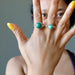 sheila of satin crystals wearing malachite double knuckle duster ring