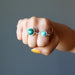 fist wearing malachite double knuckle duster ring