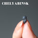 fingers holding chelyabinsk meteorite
