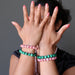 sheila of satin crystals wearing pink rhodochrosite and green malachite stretch bracelets