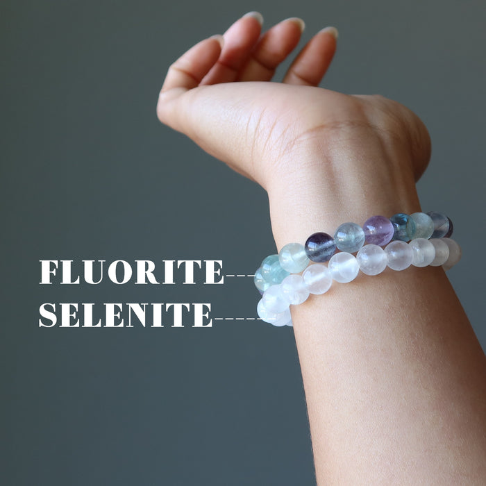 hand model showing off the fluorite and selenite bracelet combo on her wrist