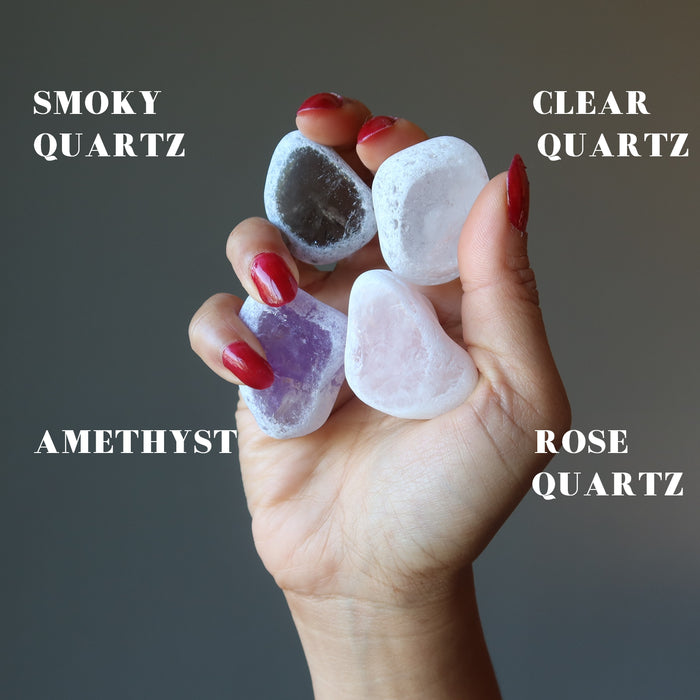 hand holding smoky quartz, clear quartz, amethyst, rose quartz picture windows