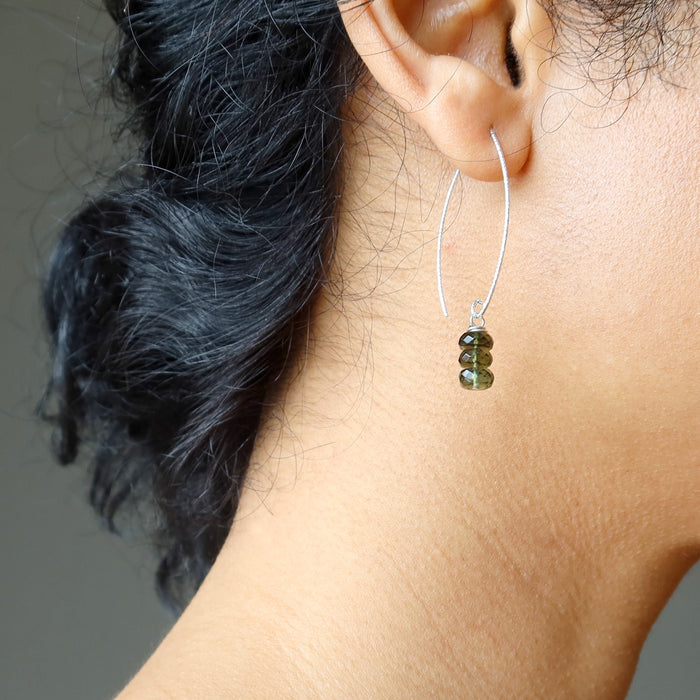 sheila of satin crystals wearing moldavite earrings