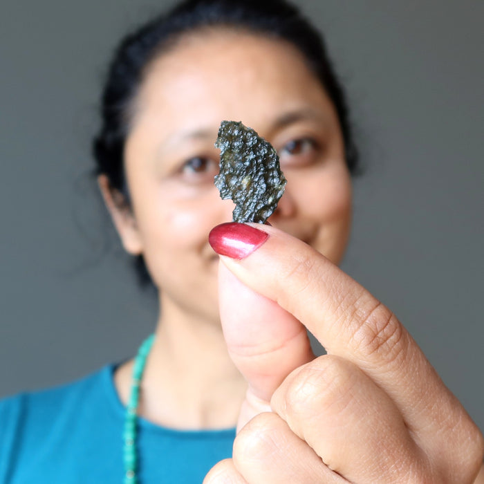 sheila of satin crystals holding real moldavite
