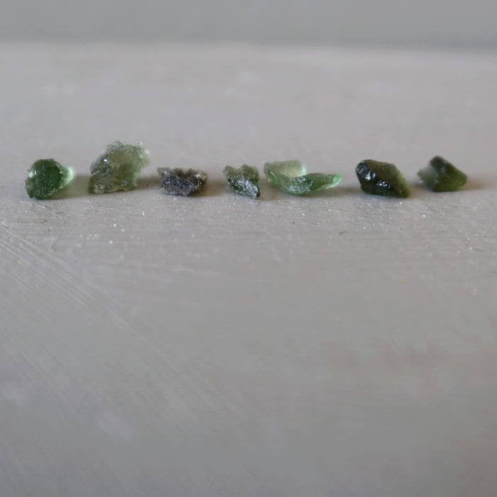 7 green raw moldavite tektites