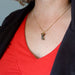 moldavite necklace on female model