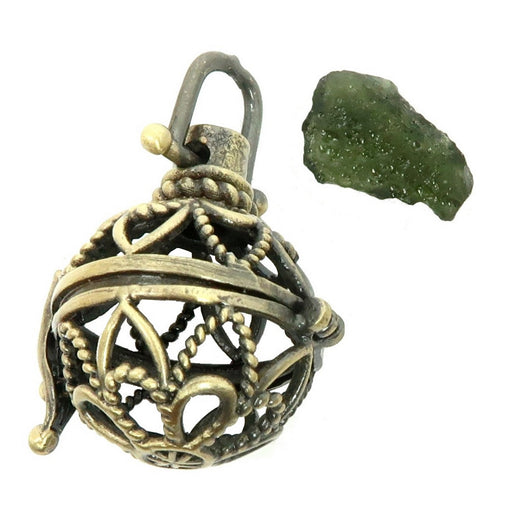 green moldavite raw gemstone and a fancy brass cage locket pendant