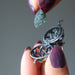 raw moldavite piece going into a locket pendant