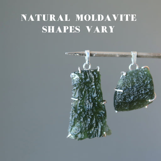 two large raw moldavite in sterling silver pendants