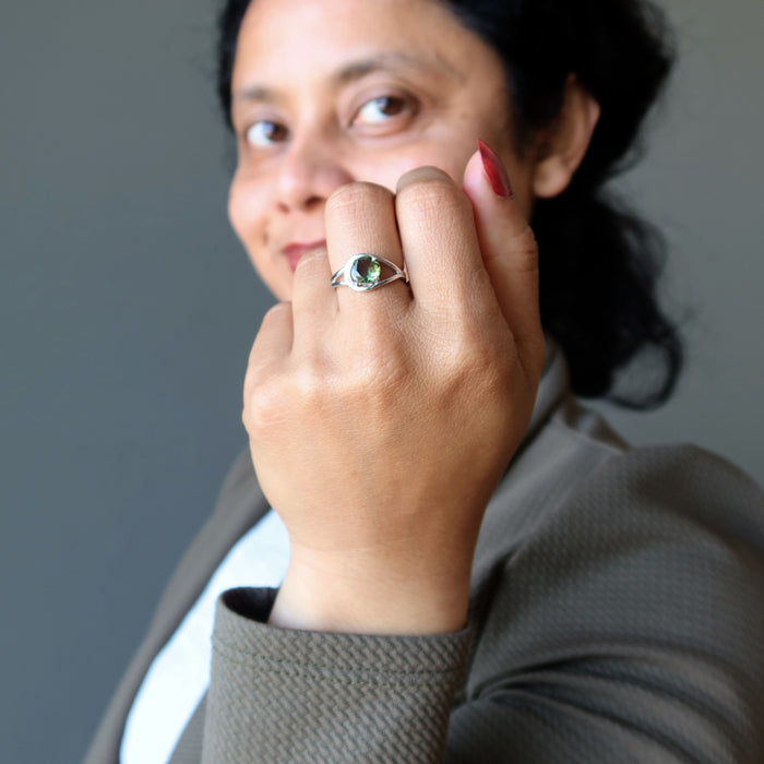sheila of satin crystals wearing a moldavite faceted ring on her finger