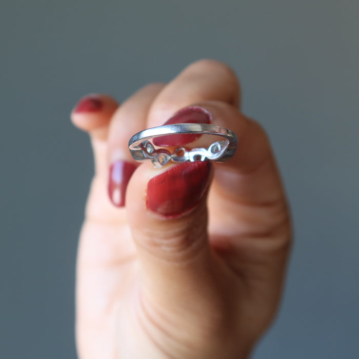 hand holding moldavite ring