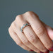 hand wearing moldavite ring