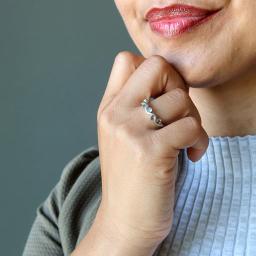 female wearing moldavite ring